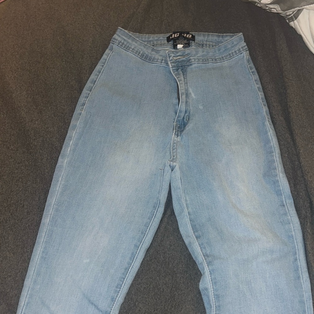 Light-blue flared jeans with a drawstring at the bottom